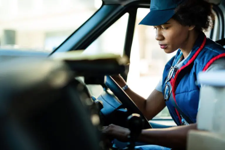 Female HGV driver in lorry